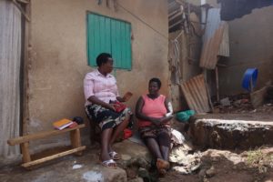 Team member Betty talking to Hellen(Pink blouse